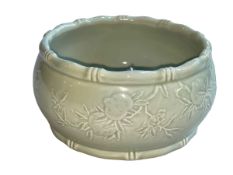 Chinese Celadon bowl with raised fruit on branch decoration, impressed seal mark to base,