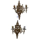 Pair of ornate brass two branch wall sconces.