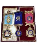 Two silver and one gilt Masonic medals.