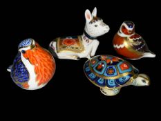 Four Royal Crown Derby paperweights including Donkey Foal, Robin, Terrapin and a bird.
