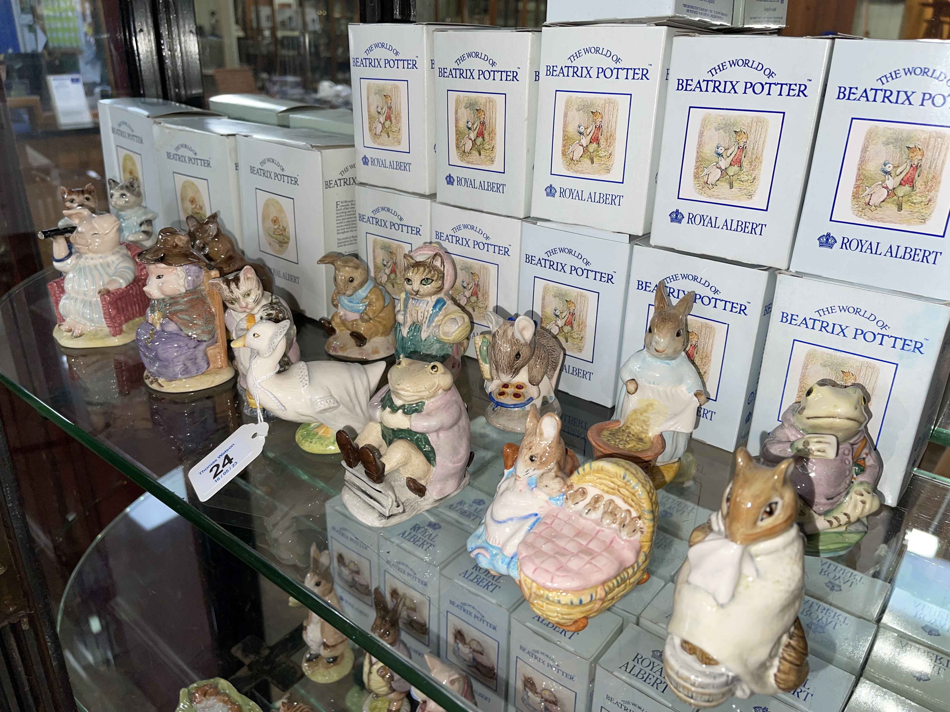 Collection of fourteen Royal Albert Beatrix Potter figures including The Christmas Stocking,