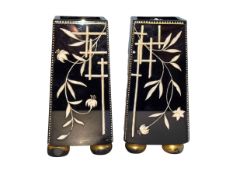 Pair of Chinese black glass vases of tapering form on bun feet decorated with bamboo and floral