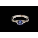 Tanzanite and diamond 9 carat white gold ring, size L/M, with papers.