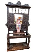 Victorian oak mirror back hallstand carved with lion masks and mythical creatures,