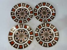 Four Royal Crown Derby Imari plates, 21.5cm diameter, with two boxes.
