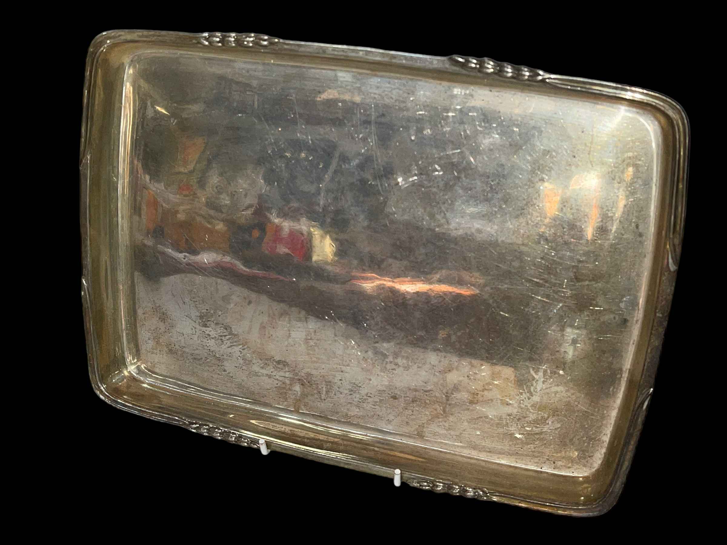 Silver tray with husk border, marks rubbed, 30.5cm across.