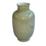 Chinese Celadon vase with raised floral pattern, Qianlong mark to base, 23cm.