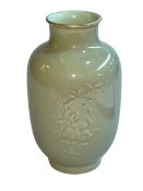 Chinese Celadon vase with raised floral pattern, Qianlong mark to base, 23cm.