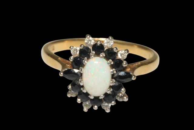 Opal, Sapphire and diamond 18 carat gold cluster ring, size R.