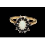 Opal, Sapphire and diamond 18 carat gold cluster ring, size R.