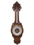 Carved oak aneroid barometer-thermometer, J Jackson, Barnard Castle, 91cm.