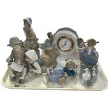 Four pieces of Lladro including Two Sisters Clock and Hurry Now, and Nao boy and girl group (3).