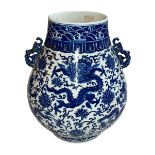 Large Chinese blue and white two handled bulbous vase decorated with dragons and flowers,