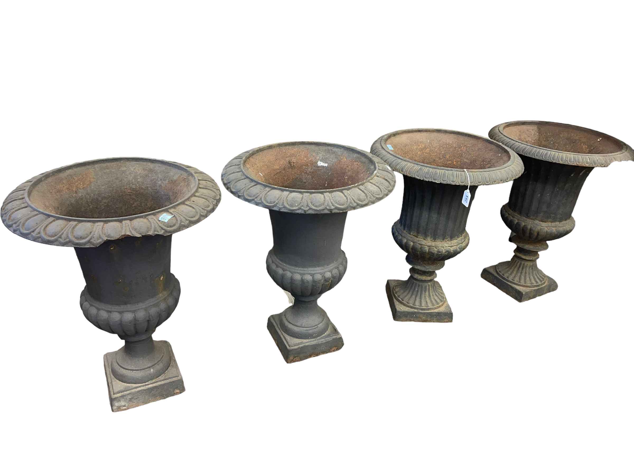 Two pairs of cast Campana style urns, 62cm by 48cm diameter.