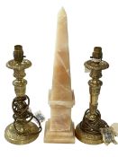 Pair of gilt metal lamp bases and a marble obelisk.