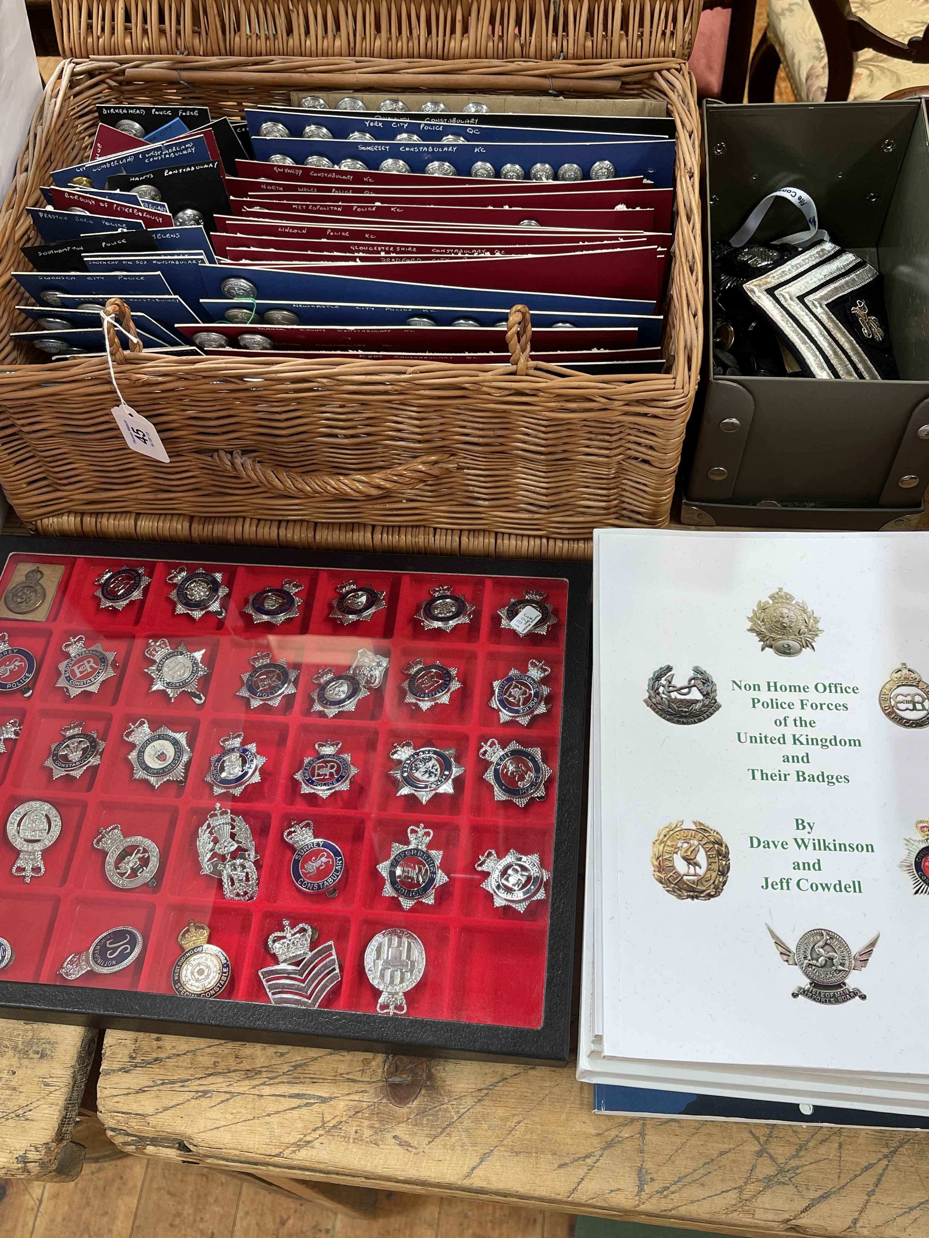 Collection of Police and Military cap badges, buttons, books, etc.