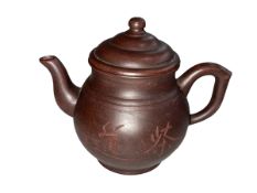 Chinese Yxing teapot decorated with calligraphy impressed mark to base, 12cm high.