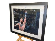 Framed Conor McGregor signed poster photo, framed with COA.