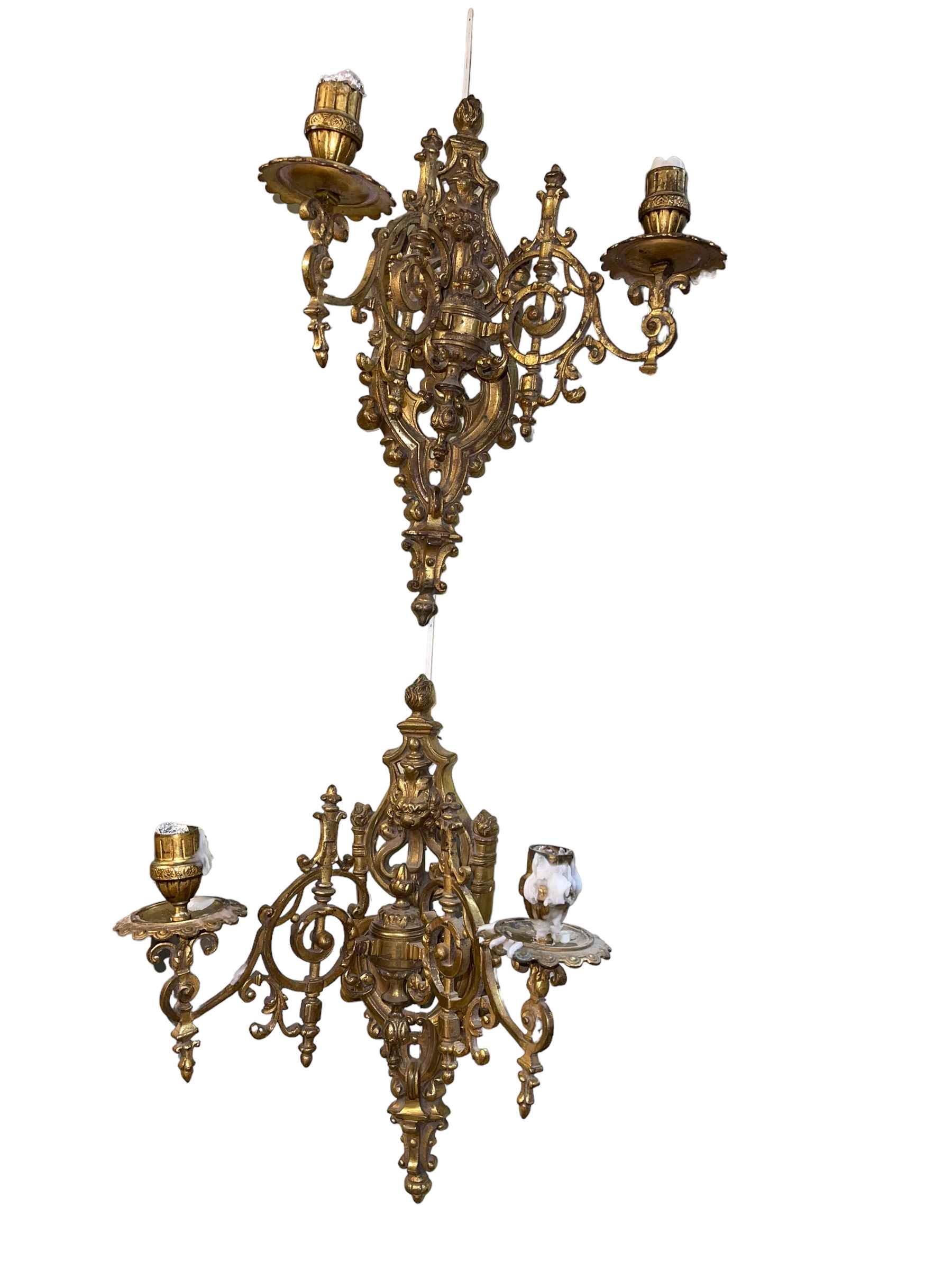 Pair of ornate brass two branch wall sconces.
