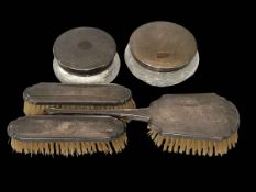 Two silver engine-turned lidded powder bowls and silver three piece brush set (5).
