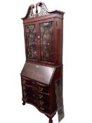 Jasper Cabinet Company polished mahogany bureau bookcase, 214cm by 88cm by 41cm.