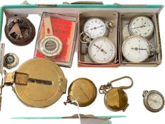 Collection of compasses and pedometers.