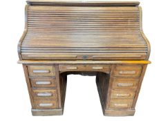 Early 20th Century oak double pedestal roll top desk, 128cm by 128cm by 81cm.