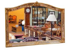 Gilt framed arched top overmantel mirror, 89cm by 129cm.