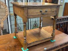 Jointed oak single drawer lamp table with undershelf on turned legs, 59cm by 61cm by 45cm.