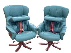 Pair stressless style green leather swivel armchairs and footstools.