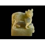 Carved Chinese soapstone dragon/dog seal with character seal, 8cm by 6cm by 5cm.