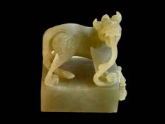 Carved Chinese soapstone dragon/dog seal with character seal, 8cm by 6cm by 5cm.