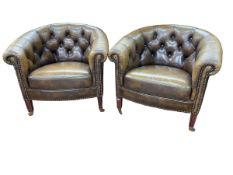 Pair buttoned leather and studded club armchairs.