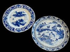 Two Chinese blue and white plates decorated with Lakes in Landscape, 24cm by 23cm diameter.