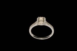 Diamond multi-stone 18 carat white gold engagement ring with three emerald cut centre stones,