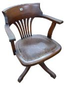 Early 20th Century oak swivel office desk chair.