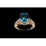 Large blue zircon and diamond 18 carat gold ring, single edition with 10.8 carat zircon, size O.