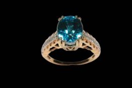 Large blue zircon and diamond 18 carat gold ring, single edition with 10.8 carat zircon, size O.