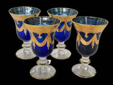 Four Medici hand blown wine glasses.