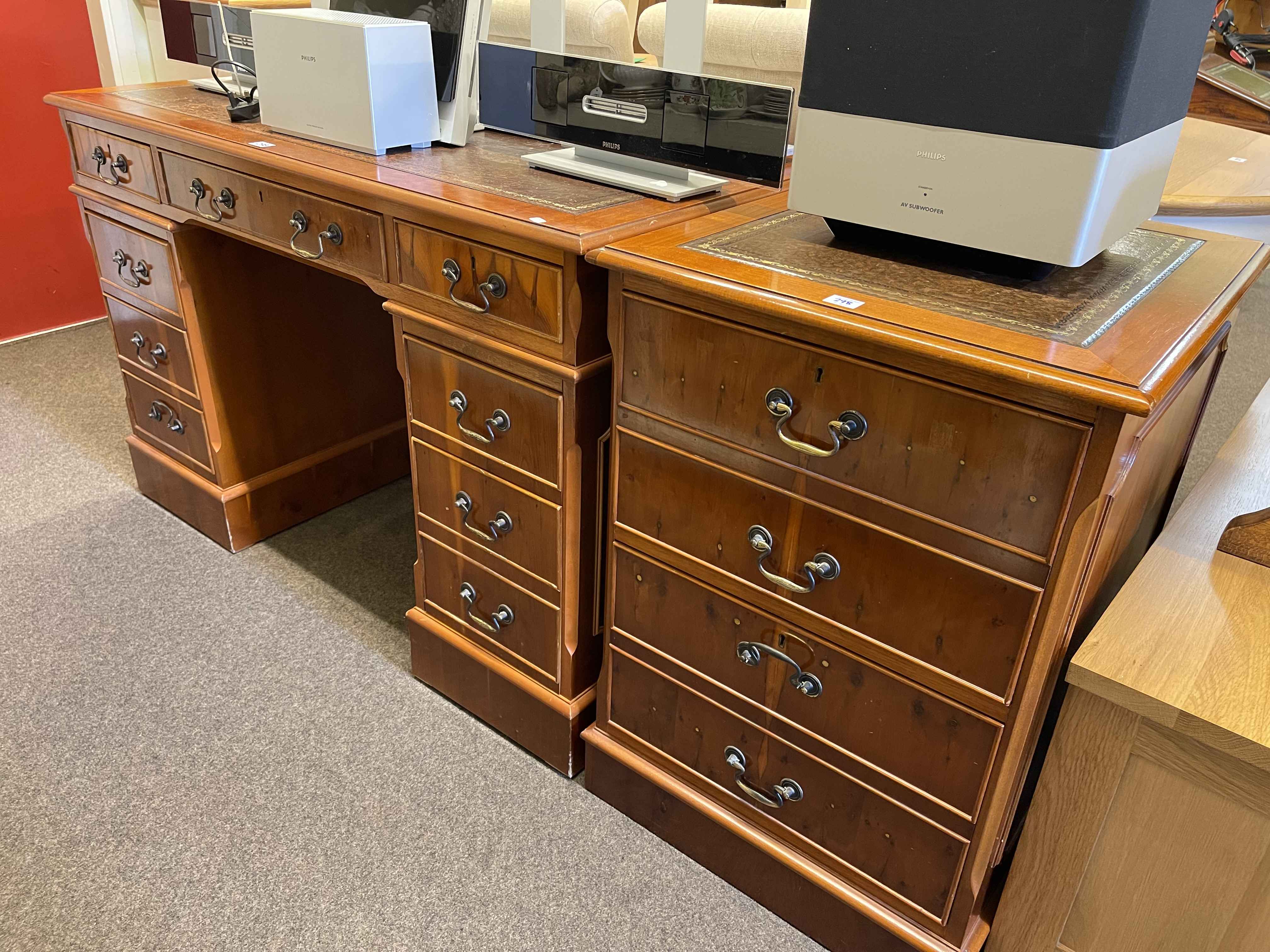 Yew eight drawer pedestal desk, 78cm by 121cm by 60cm and matching two drawer filing cabinet,