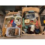 Two boxes of collectables including tins, keys, Burago Diecast toy car, Wade, etc.