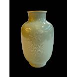 Chinese Celadon vase with raised floral pattern, Qianlong mark to base, 23cm.