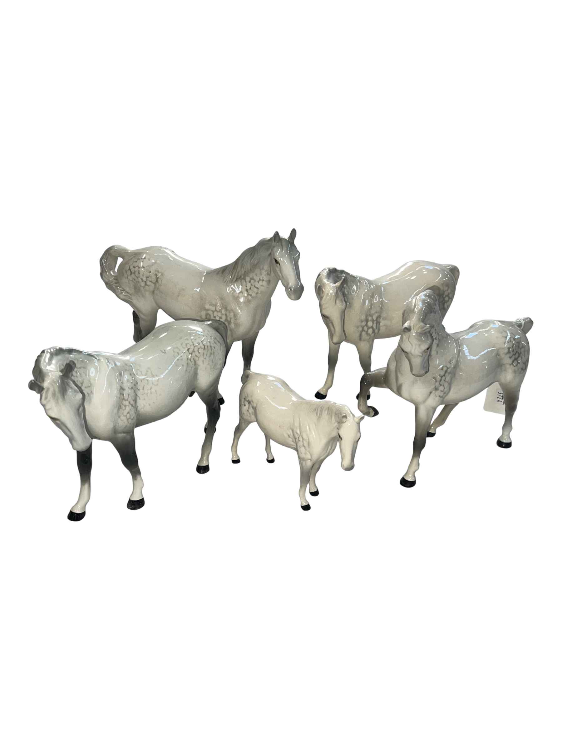 Five Beswick dapple grey horses including swish tail.