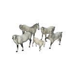 Five Beswick dapple grey horses including swish tail.