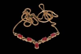 Ruby and diamond 9 carat gold necklace, boxed.