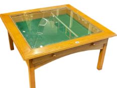 Contemporary low centre display table, 45cm by 88cm by 88cm.