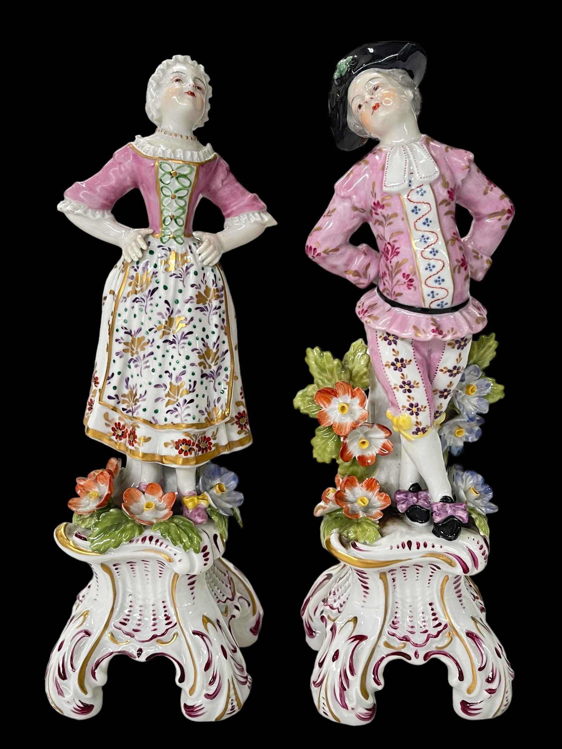 Pair of Continental lady and gent figures, 21cm high.