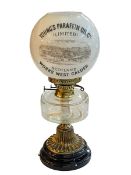 Brass and glass oil lamp with advert shade, Young's Paraffin Oil Co Works West Calder.