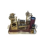 Two brass mining pulley tower and coal wagon ornaments,