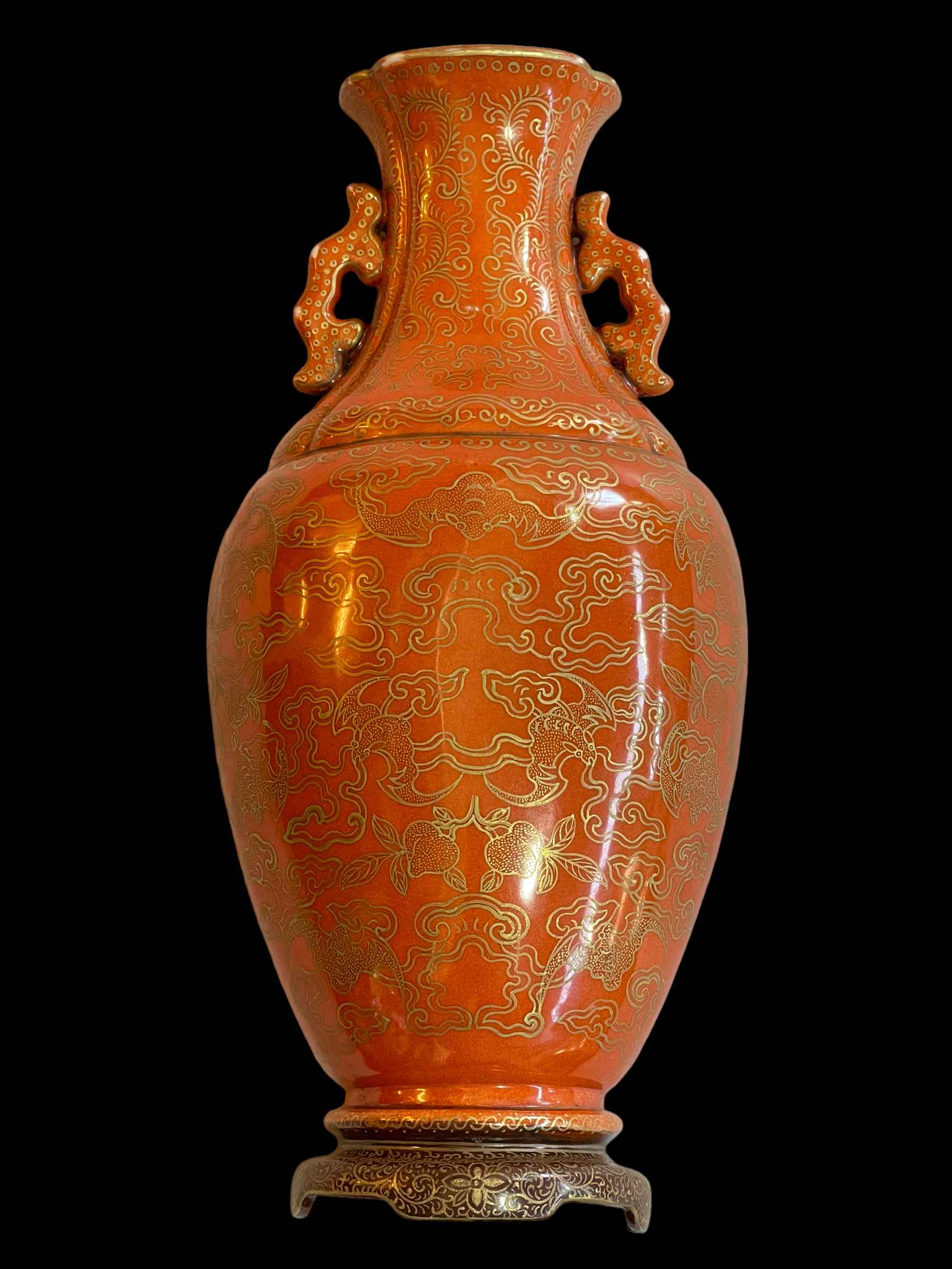 Chinese wall pocket vase decorated with gilt painted bats and clouds on orange ground, 26cm.